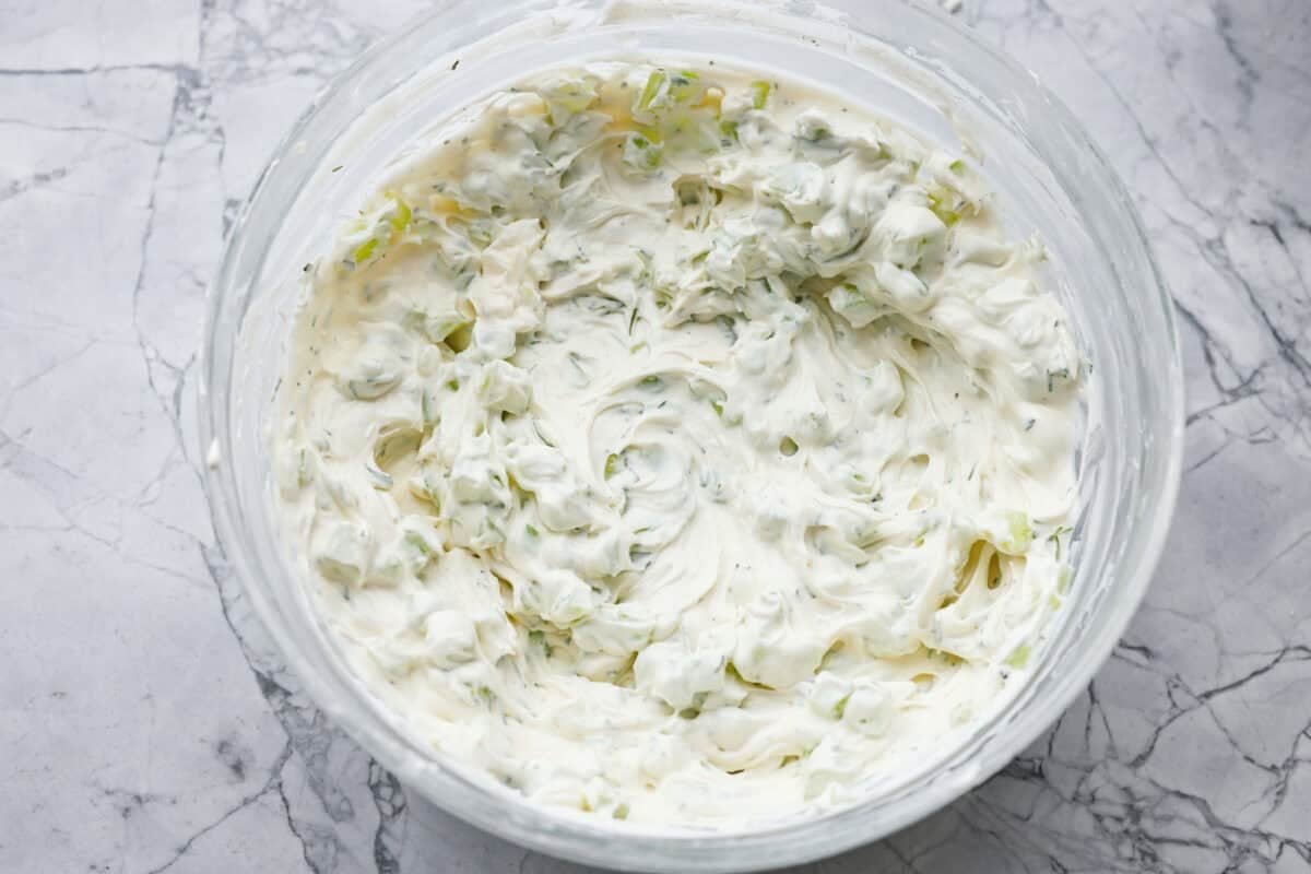 Enjoy right away, or chill for an hour to let the flavors blend and the dip thicken a bit. Cucumber, ranch seasoning and fresh dill added to the cream cheese and sour cream mixture.