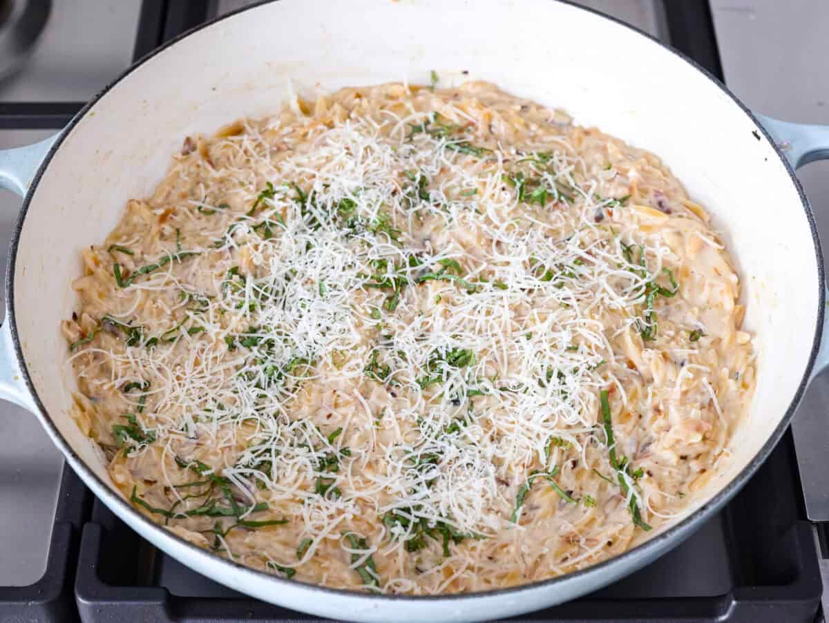 Fresh lemons make me so happy! They’re bright, cheerful, and lift me out of the winter rut. Add that citrusy sunshine to a creamy pasta, and you get this dreamy Creamy Lemon Orzo! Simple, rich, and bursting with feel-good flavor. Lemon juice, cream and other ingredients added to the orzo.