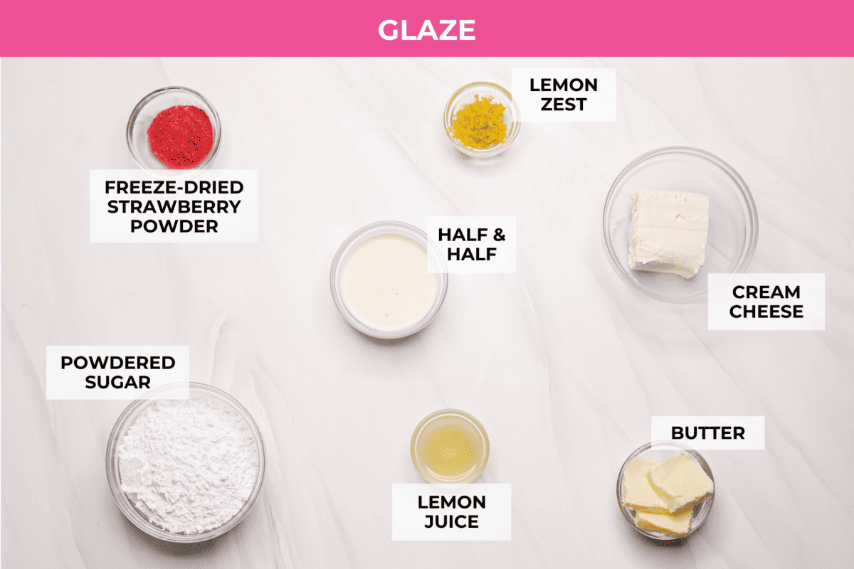 Strawberry cinnamon rolls are going to become a tradition in your house after you make these! The secret is the freeze-dried strawberries mixed with the lemon zest in the glaze - the flavor is to die for! Overhead shot of labeled strawberry cinnamon roll glaze ingredients.