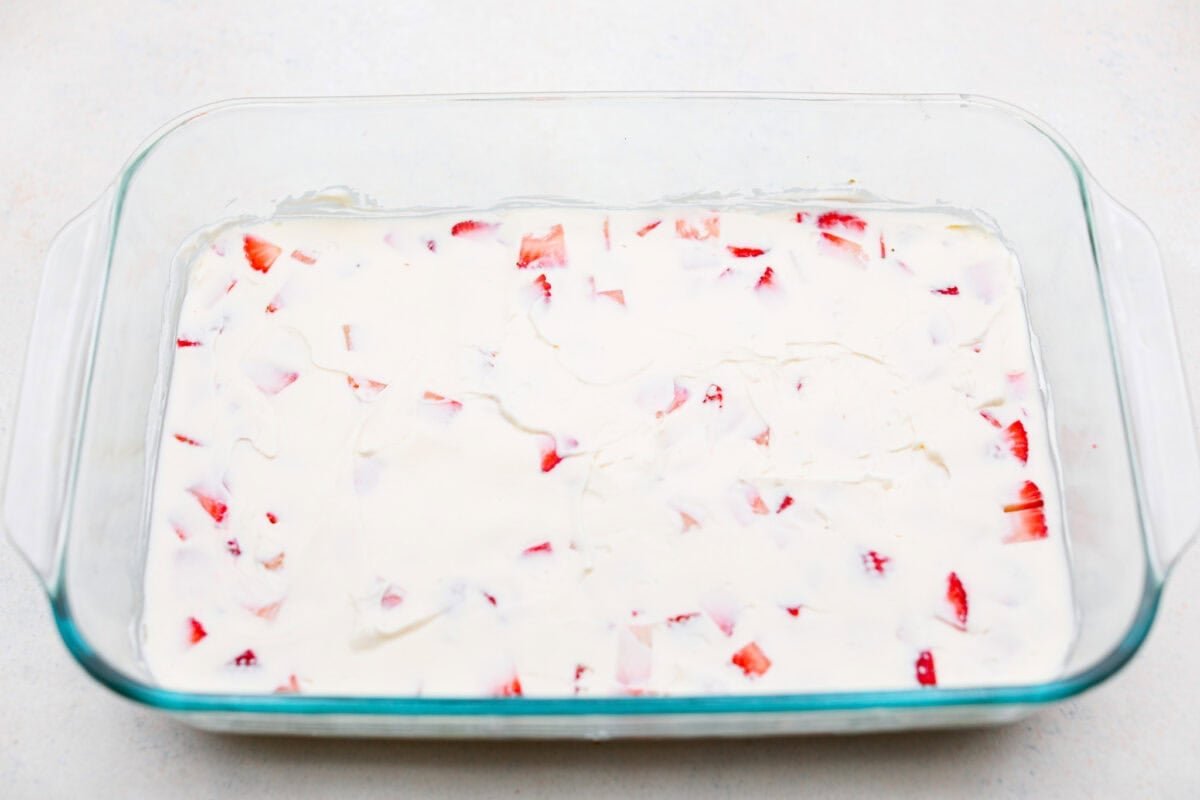 My Strawberry Delight is the ultimate summer showstopper! Buttery crust, juicy strawberries, sweet jello, and fluffy topping—one bite and everyone’s hooked. Cream cheese layer spread over strawberries and crust.