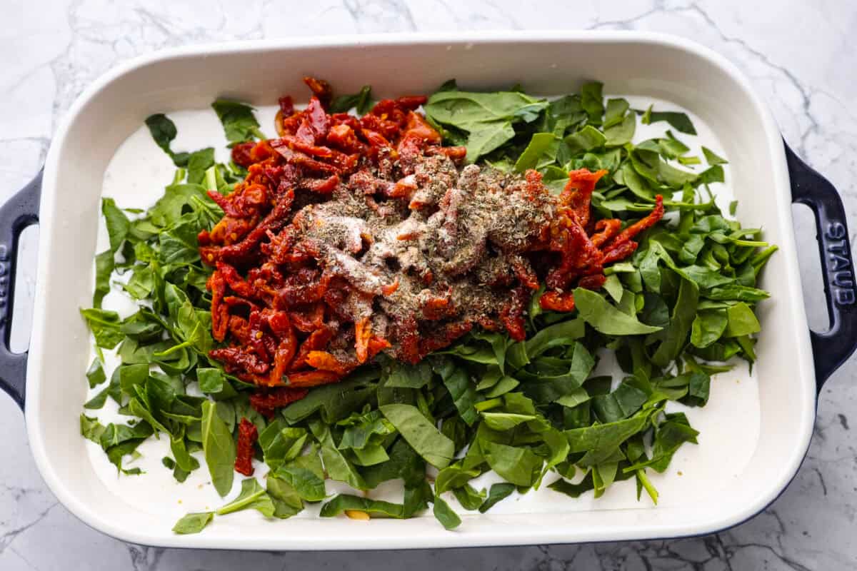 You all love my Crockpot Tuscan Chicken, and I know casseroles are a favorite as well. So, I combined them into this irresistibly delicious Tuscan Chicken Casserole! Casserole ingredients all in the baking dish.