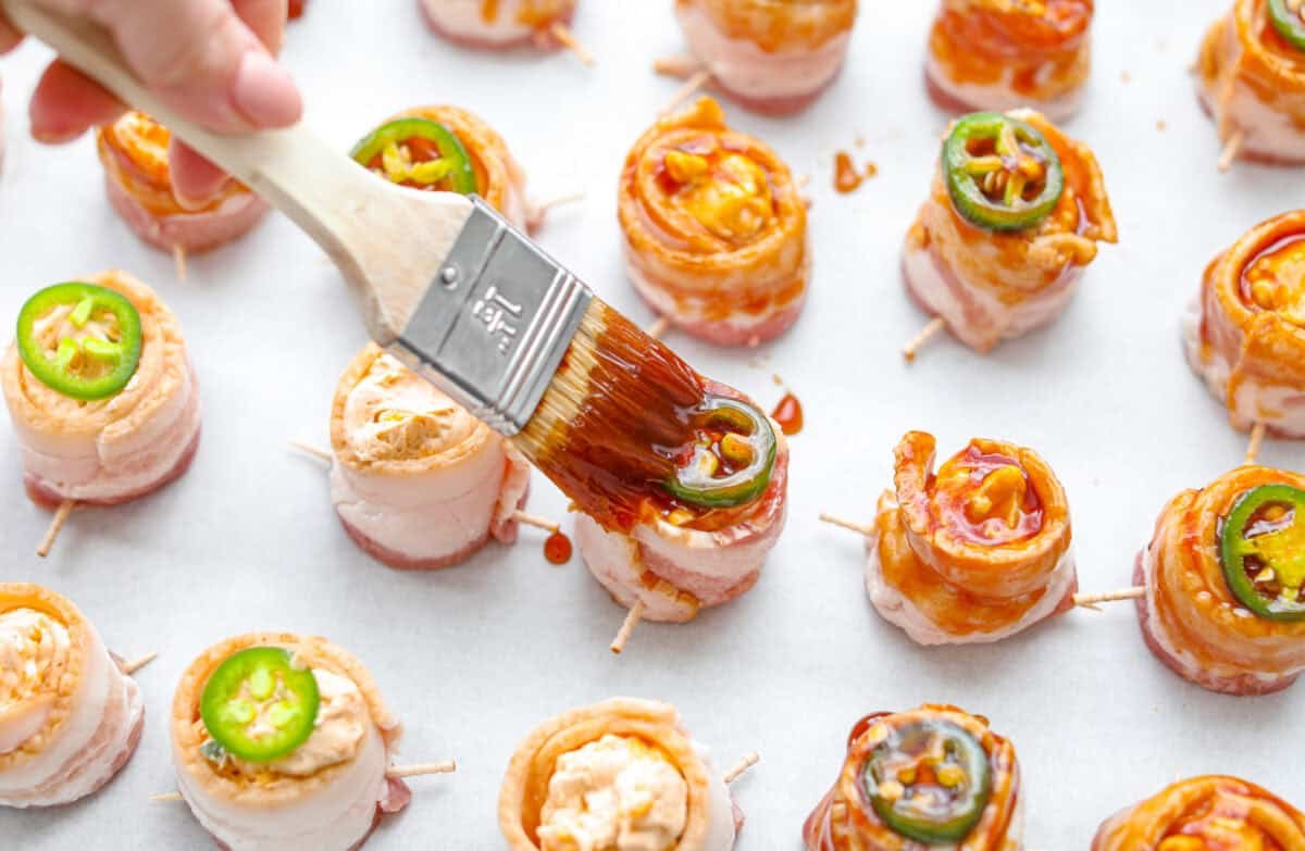https://www.target.com/p/excalibur-seasoning-smokehouse-bbq-rub-seasoning-6oz-shaker-bottle/-/A-93218011#lnk=sametab Overhead shot of someone brushing the bbq sauce glaze on the pig shots.