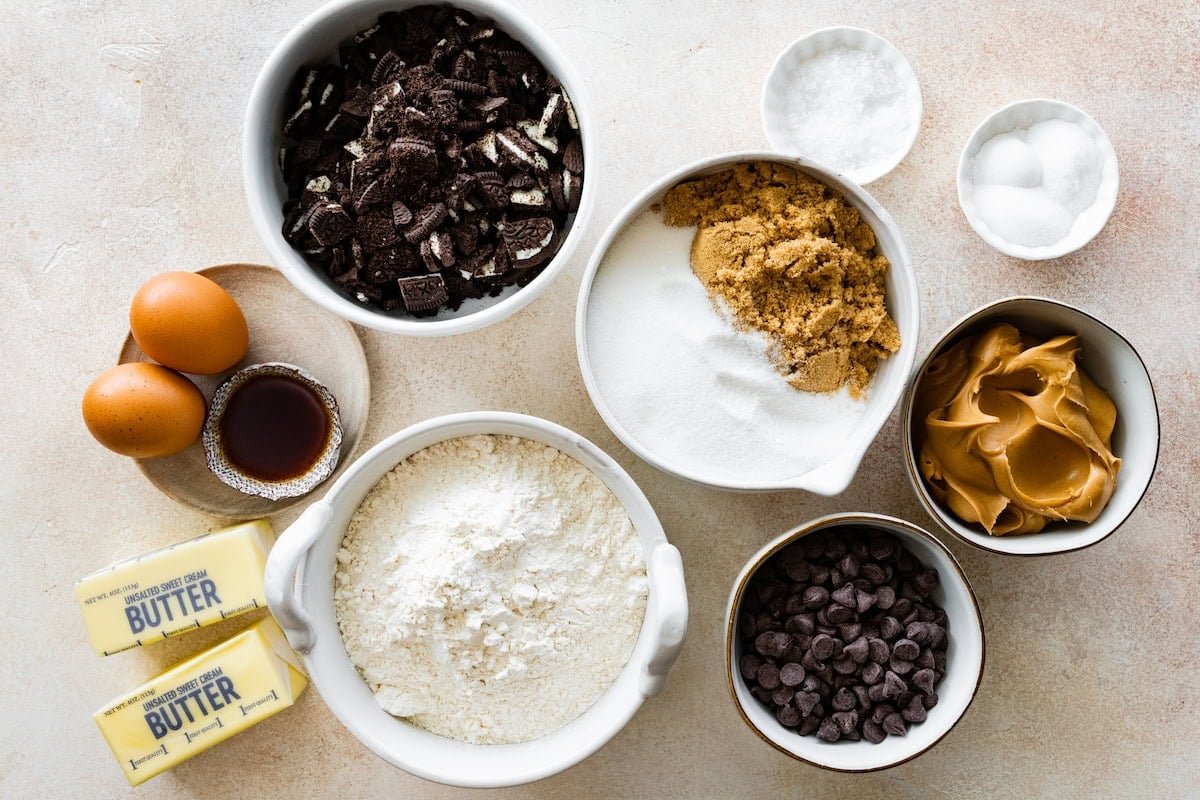 ingredients in bowls to make peanut butter Oreo cookies.
