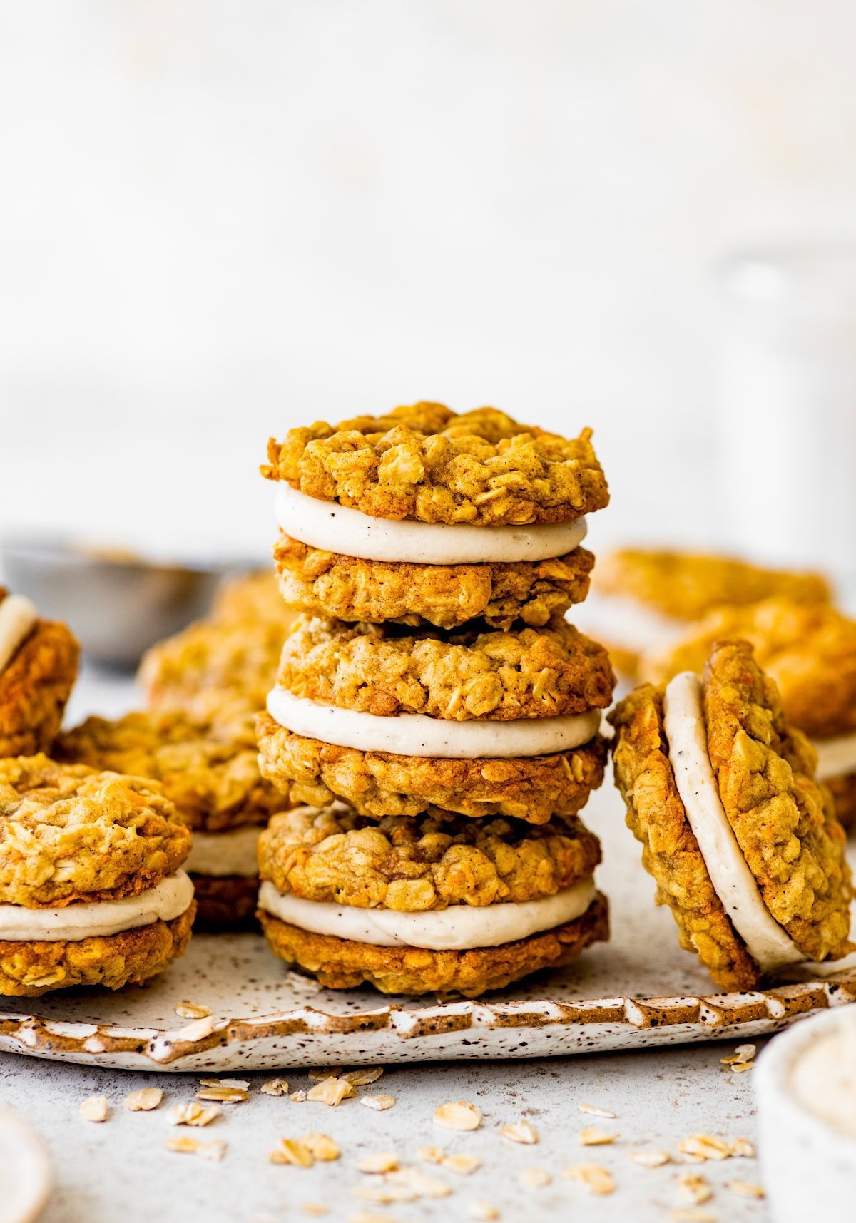 stack of carrot cake sandwich cookies with brown butter cream cheese filling. 
