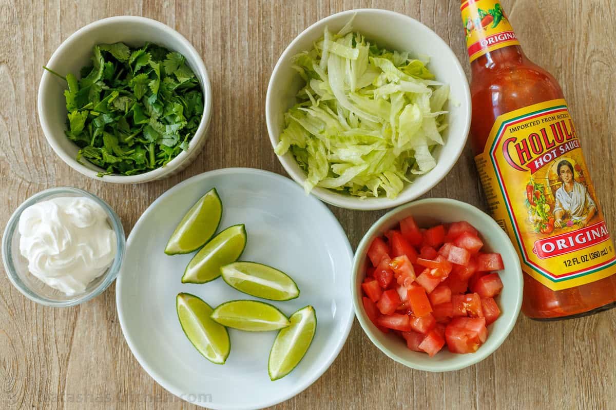 My Baked Chicken Tacos recipe is a fast and delicious 30-minute meal using rotisserie chicken and Rotel for an out-of-this world easy dinner! Toppings for Mexican dinner recipe