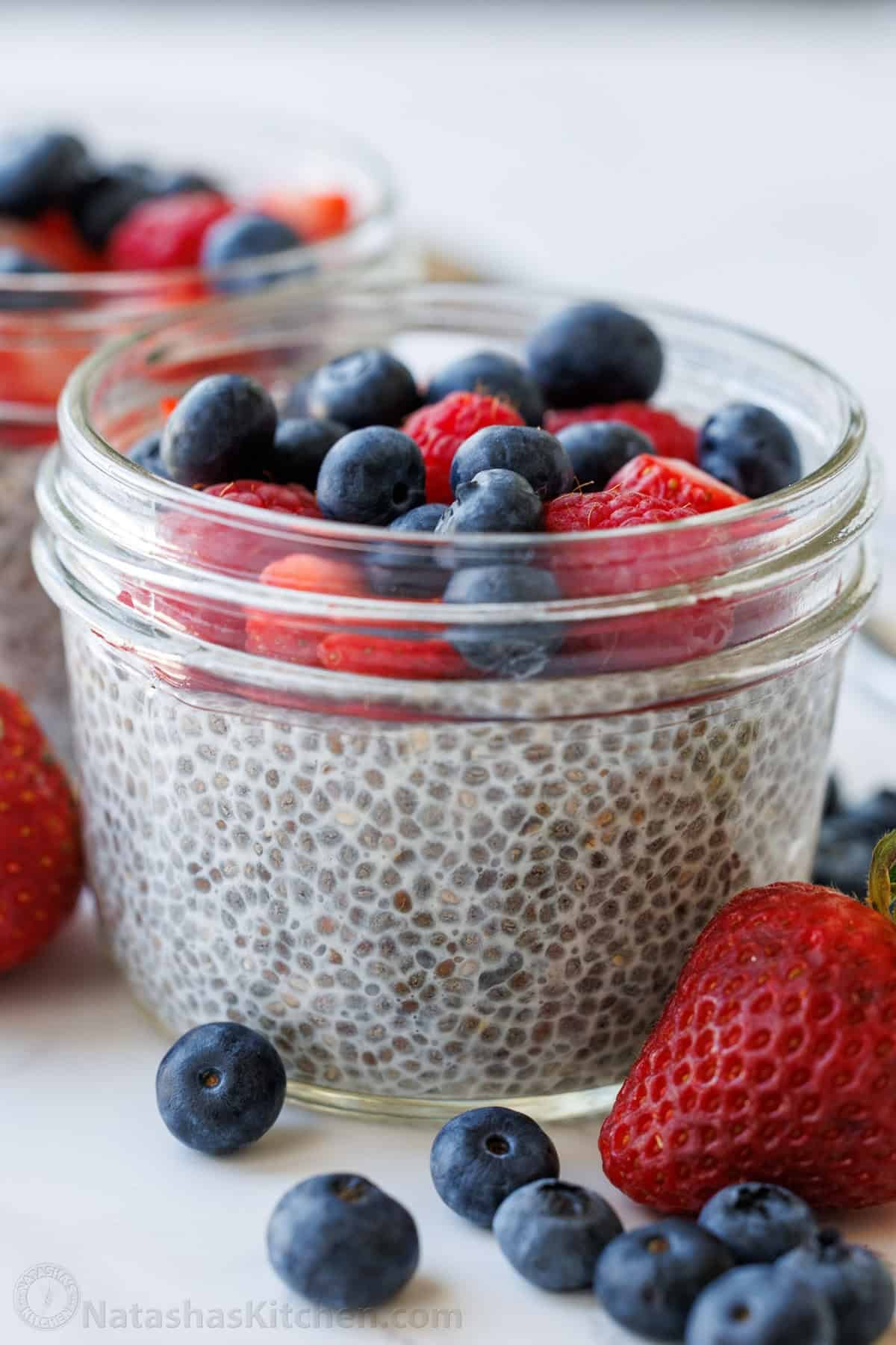 Chia Seed Pudding uses only 3 ingredients to make a delicious and filling breakfast you can prep ahead. Add toppings for the perfect bite. overnight chia pudding in a mason jar with fruit on top