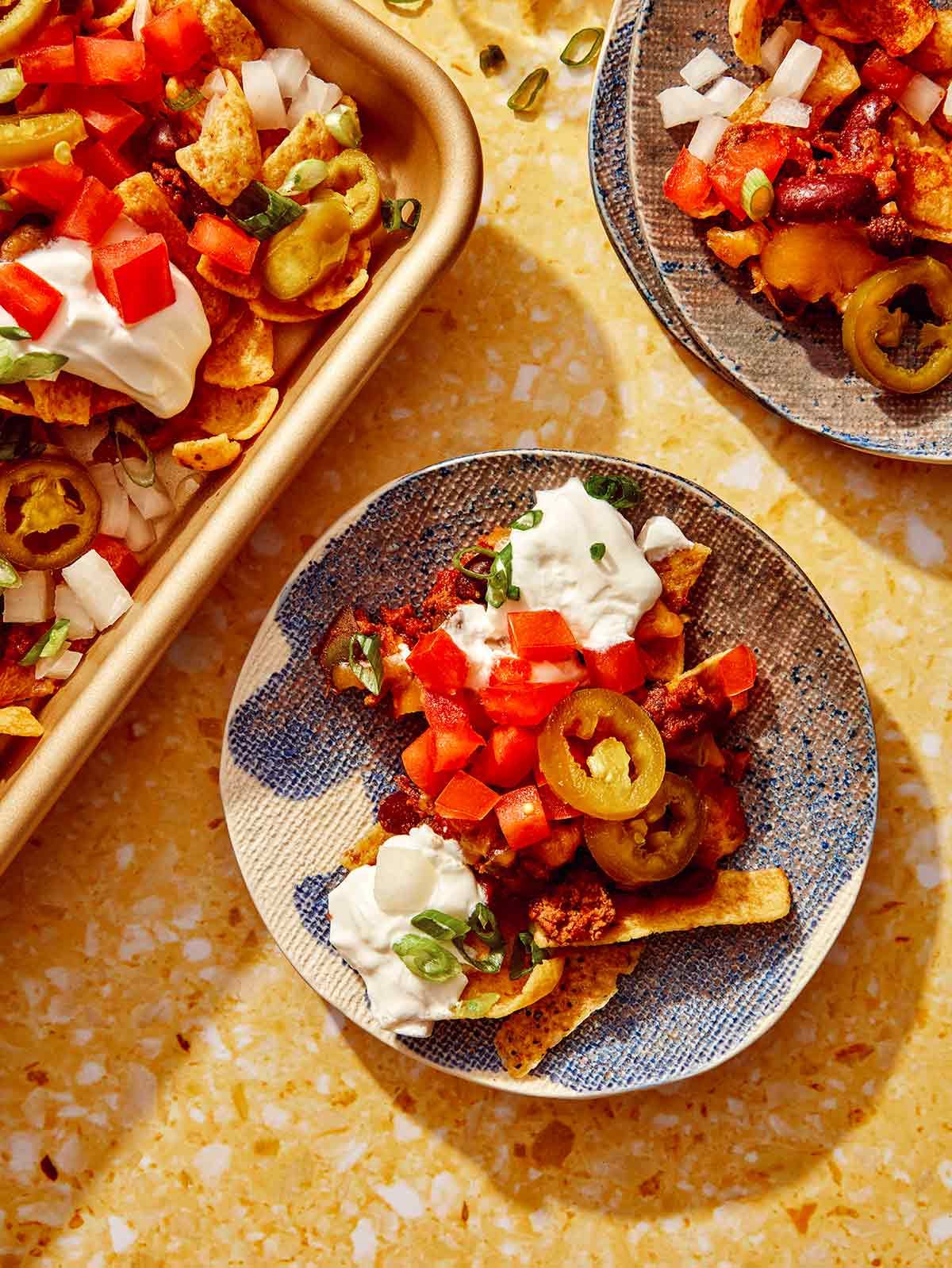 Frito pie on an appetizer plate.