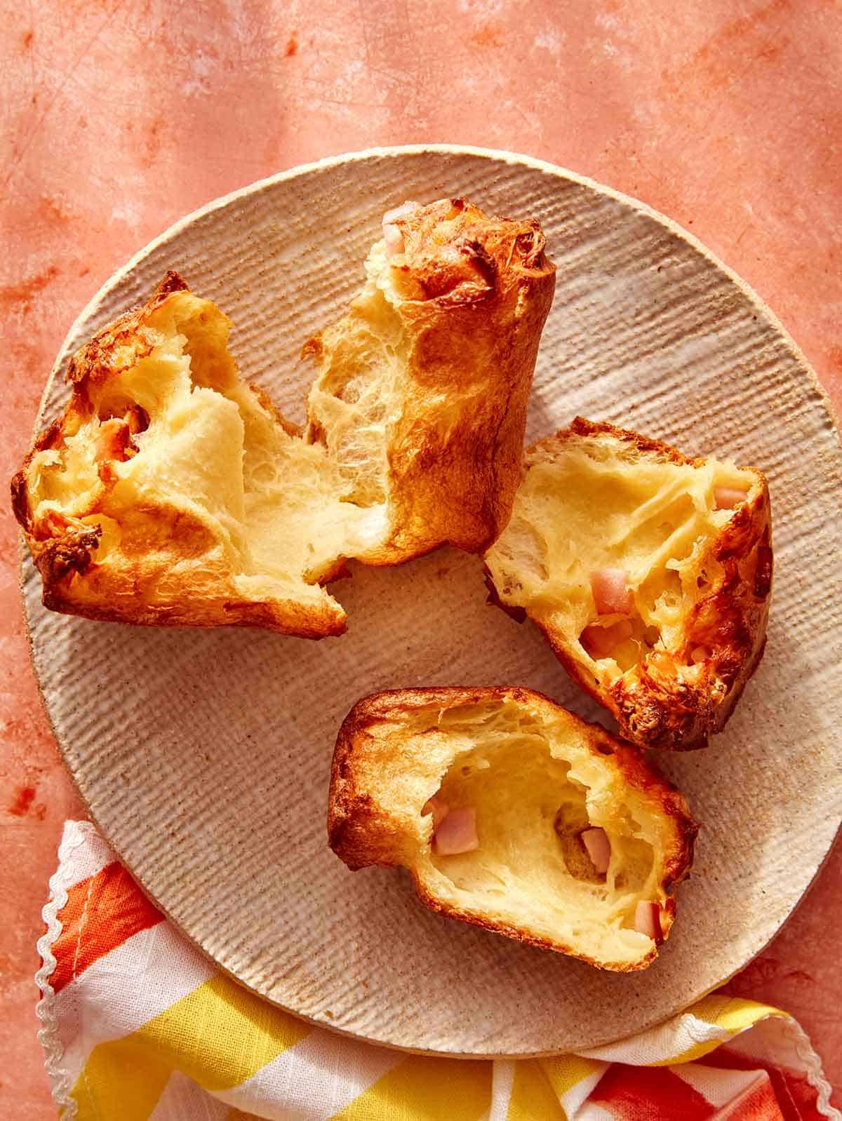A popover on a plate torn in half.