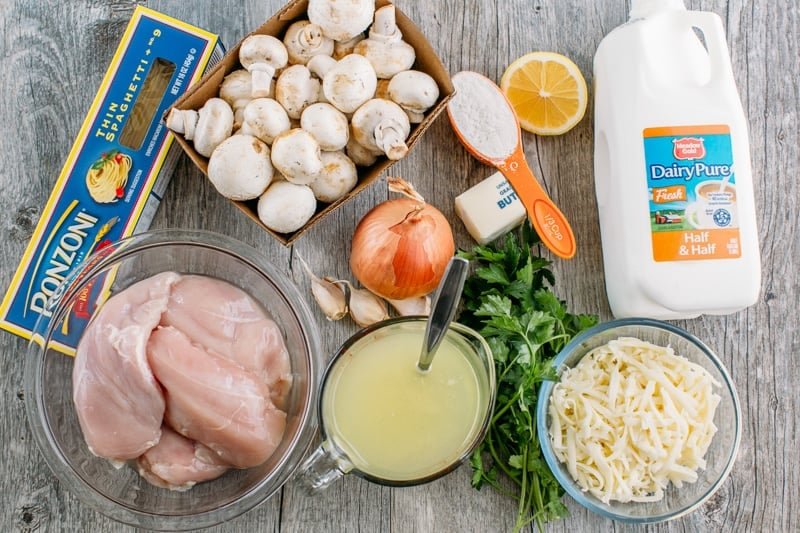 Chicken Tetrazzini is a cheesy, creamy chicken pasta bake that will have your family refilling their bowls! Make this easy casserole today! Chicken Tetrazzini ingredients including pasta, mushrooms, flour, lemon juice, butter, onion, garlic, chicken breasts, chicken stock, parsley, half & half and mozzarella cheese