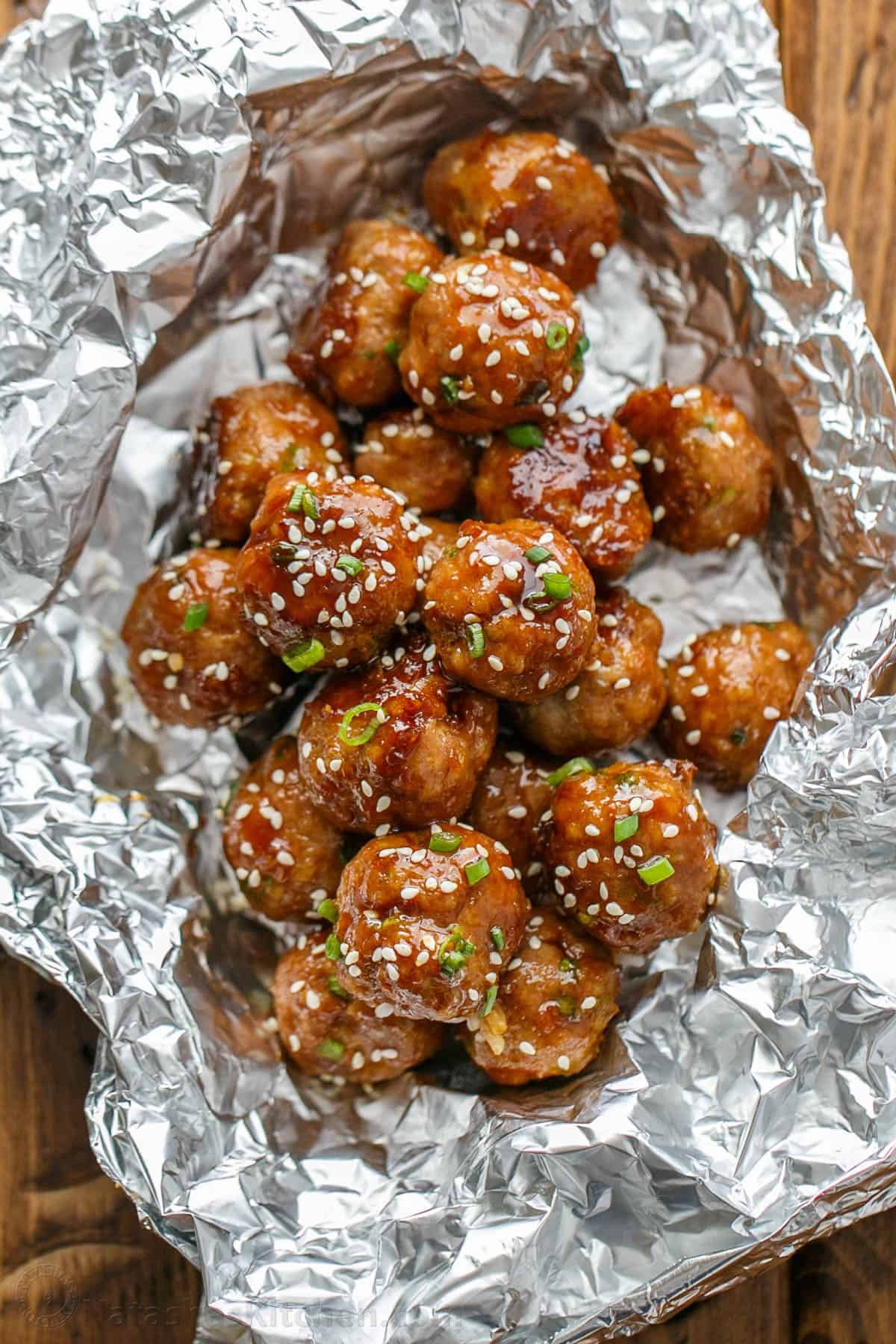 30-minute Turkey Teriyaki Meatballs are just as juicy with less guilt! Simply bake the meatballs and cover them with homemade teriyaki glaze. Baked Teriyaki Meatballs ready for storing in the refrigerator or freezer