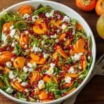 persimmon salad with maple vinaigrette with mixed greens and goat cheese