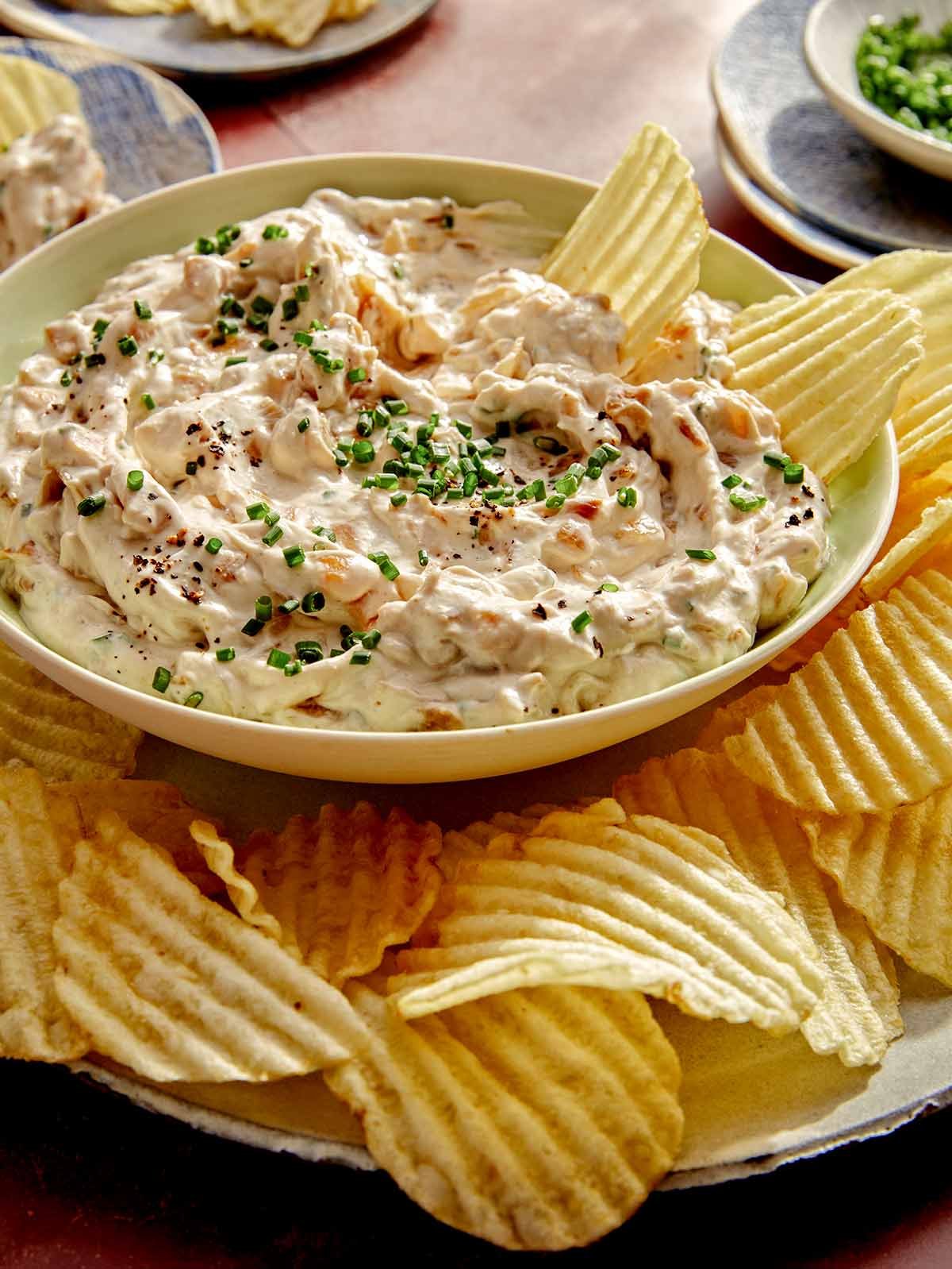 French onion dip being served with potato chips.
