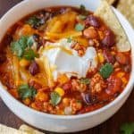 turkey chili recipe topped with cheese and sour cream