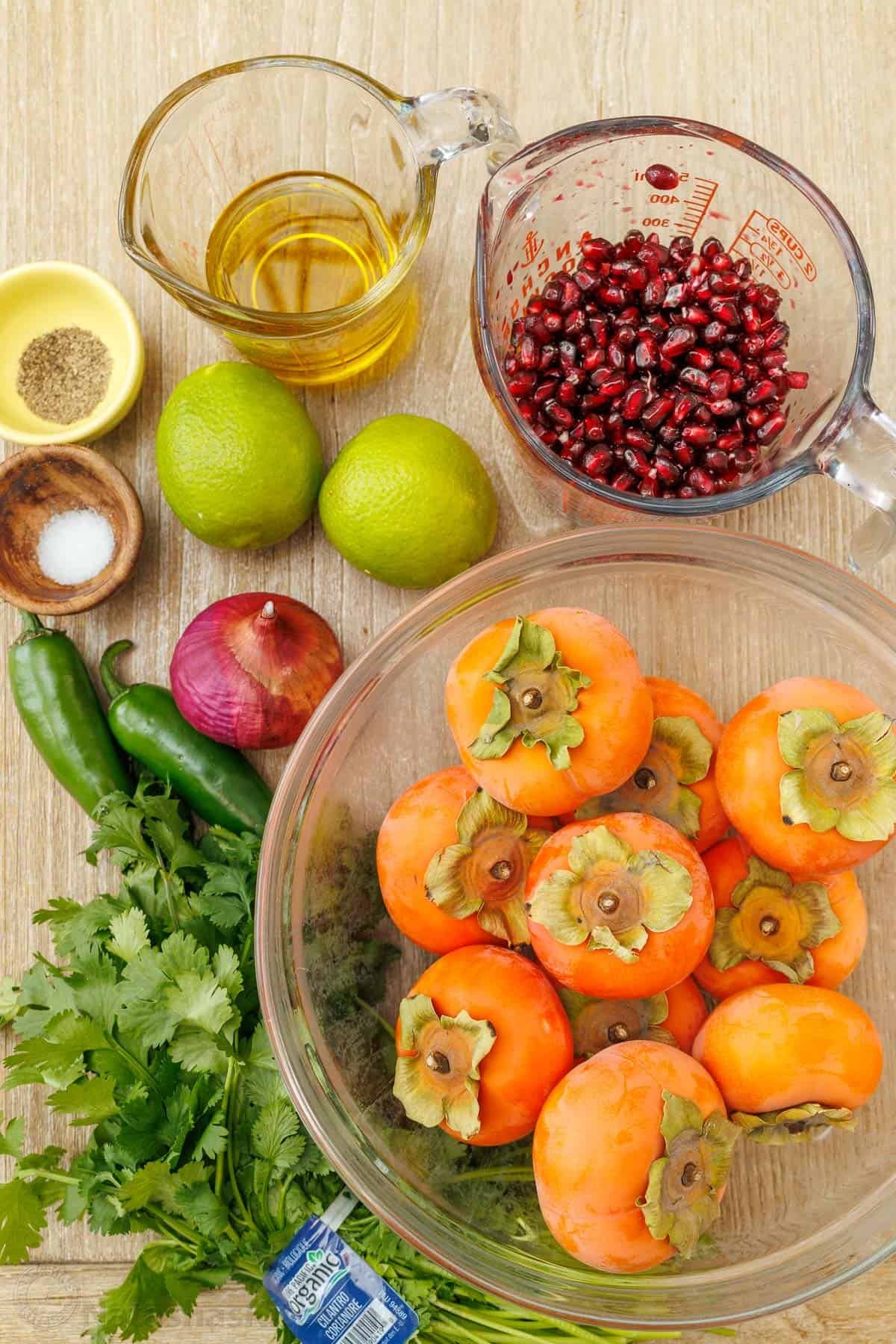 This easy persimmon pomegranate salad with lime cilantro dressing is one of the most exciting salads I've tried. It's vibrant and memorable! ingredients for persimmon pomegranate salad