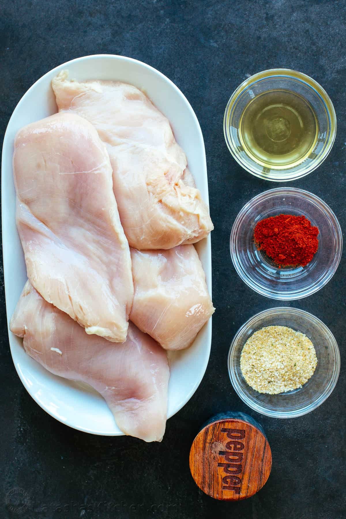 This Baked Chicken Breast is tender, juicy, and perfectly seasoned - versatile and great for meal prep! Say goodbye to dry, boring chicken! Ingredients for Baked chicken breast with spices and boneless skinless chicken breast