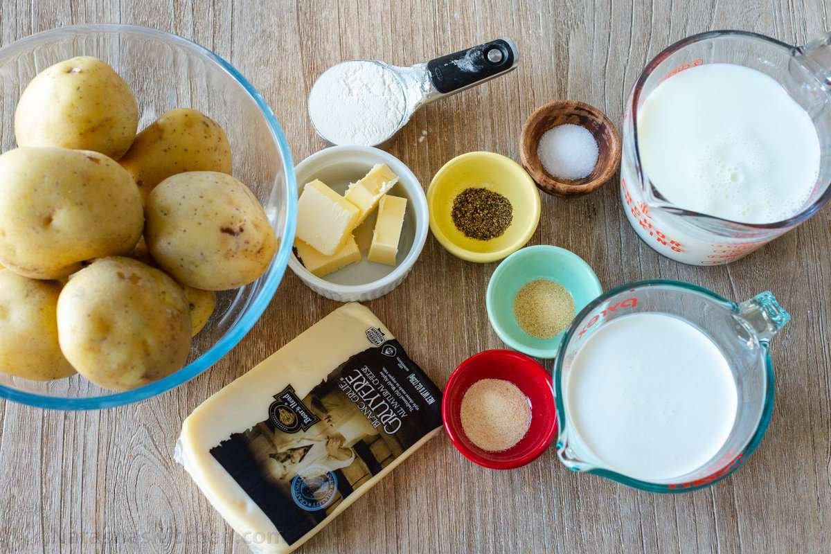 Creamy Au Gratin Potatoes are an easy holiday side dish, made with thinly sliced potatoes baked in a rich and velvety cheese sauce. The ingredients for au gratin potatoes.