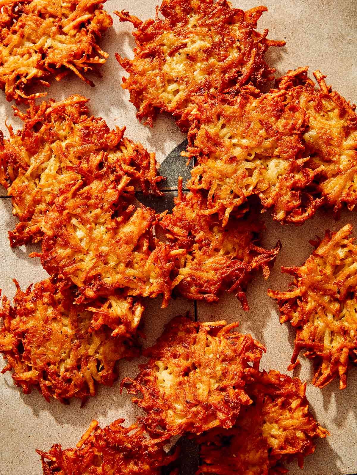 Close up on potato latkes with crispy edges.
