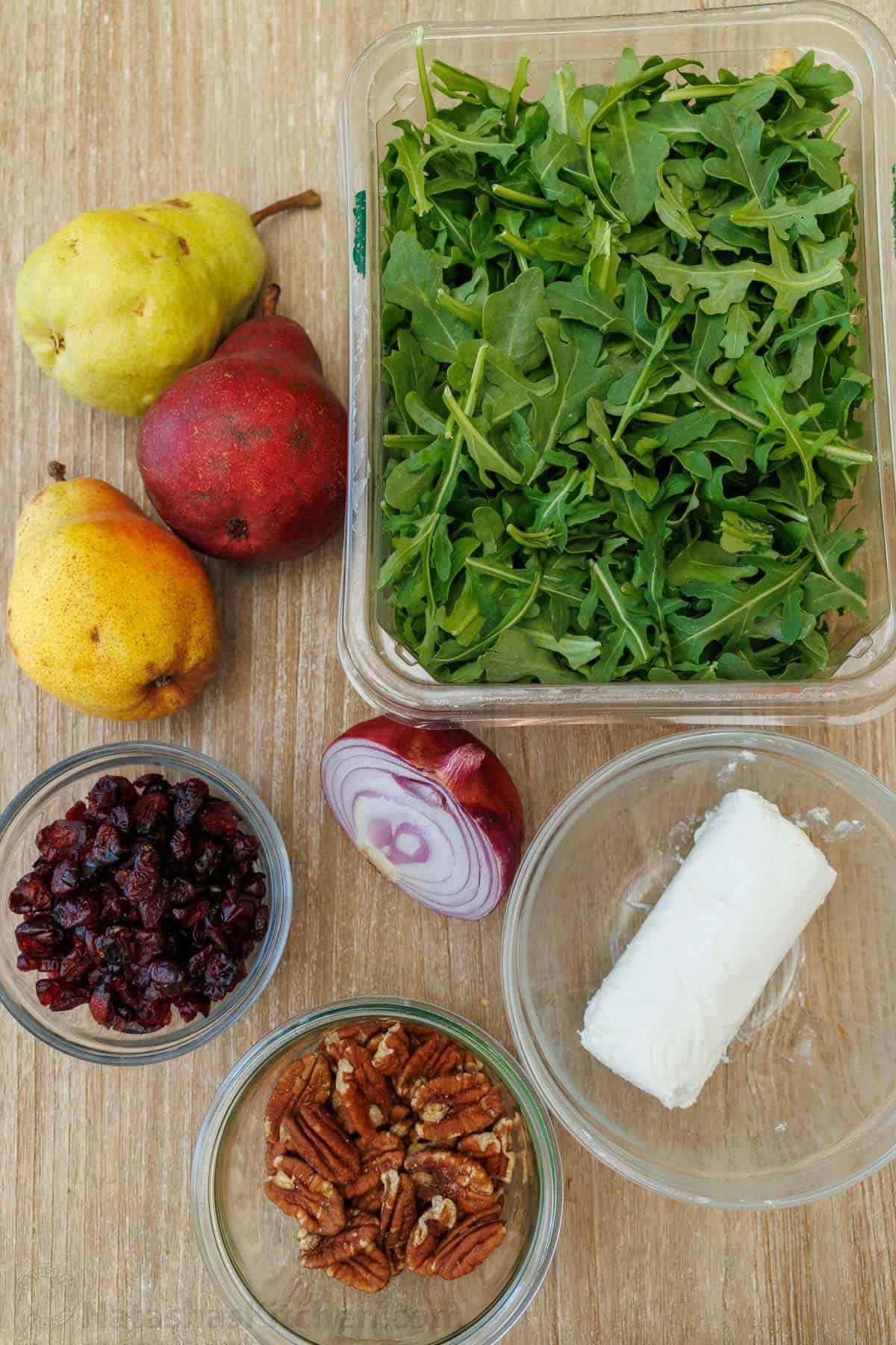 Ingredients for Pear Salad: Red onion, arugula, pears (preferably a variety), goat cheese, dried cranberries. Ingredients for Pear Salad: Red onion, arugula, a colorful variety of pears, goat cheese, dried cranberries