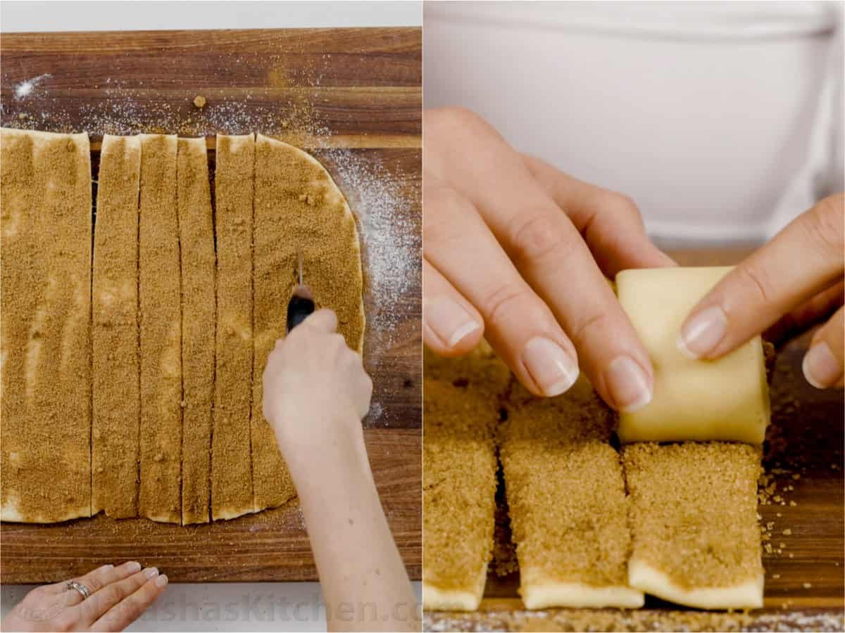 Learn how to Make Sourdough Cinnamon Rolls Slicing strips of dough with pizza cutter and rolling up the dough into a cinnamon roll.