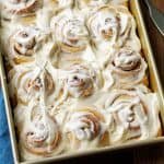 Frosted Sourdough Cinnamon Rolls in a baking dish