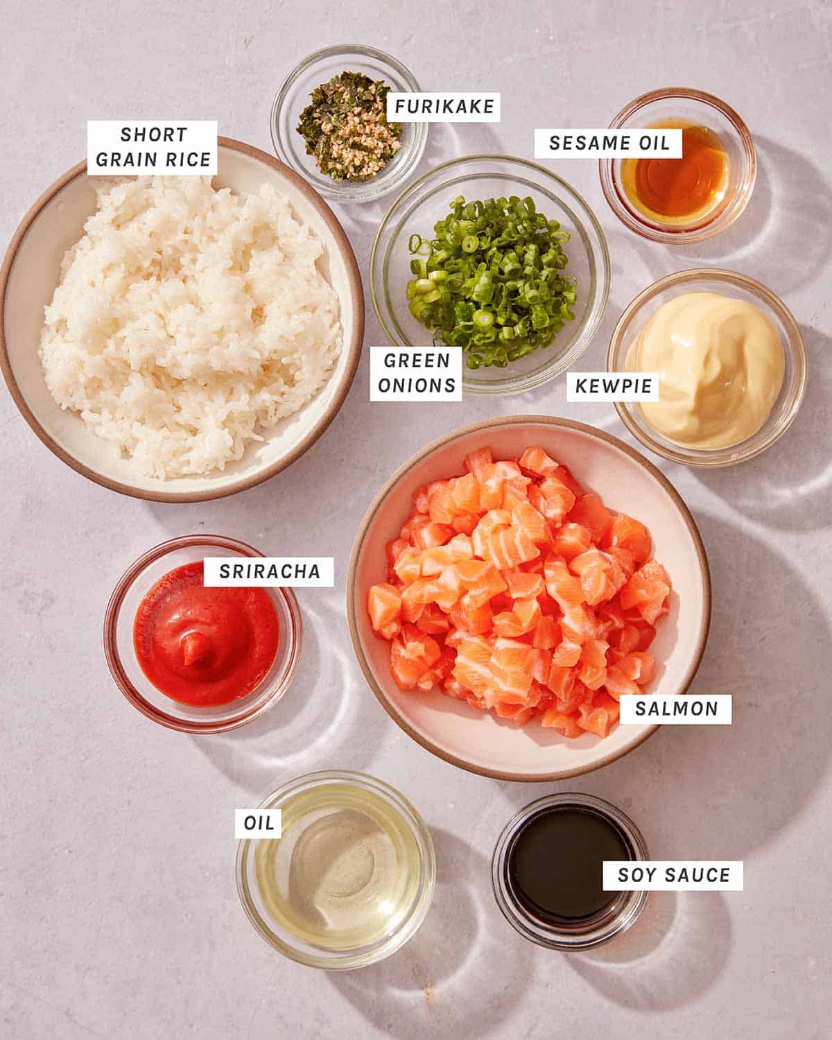 Sushi pizza recipe ingredients in bowls. 