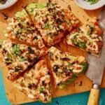 Sushi pizza recipe on a cutting board.