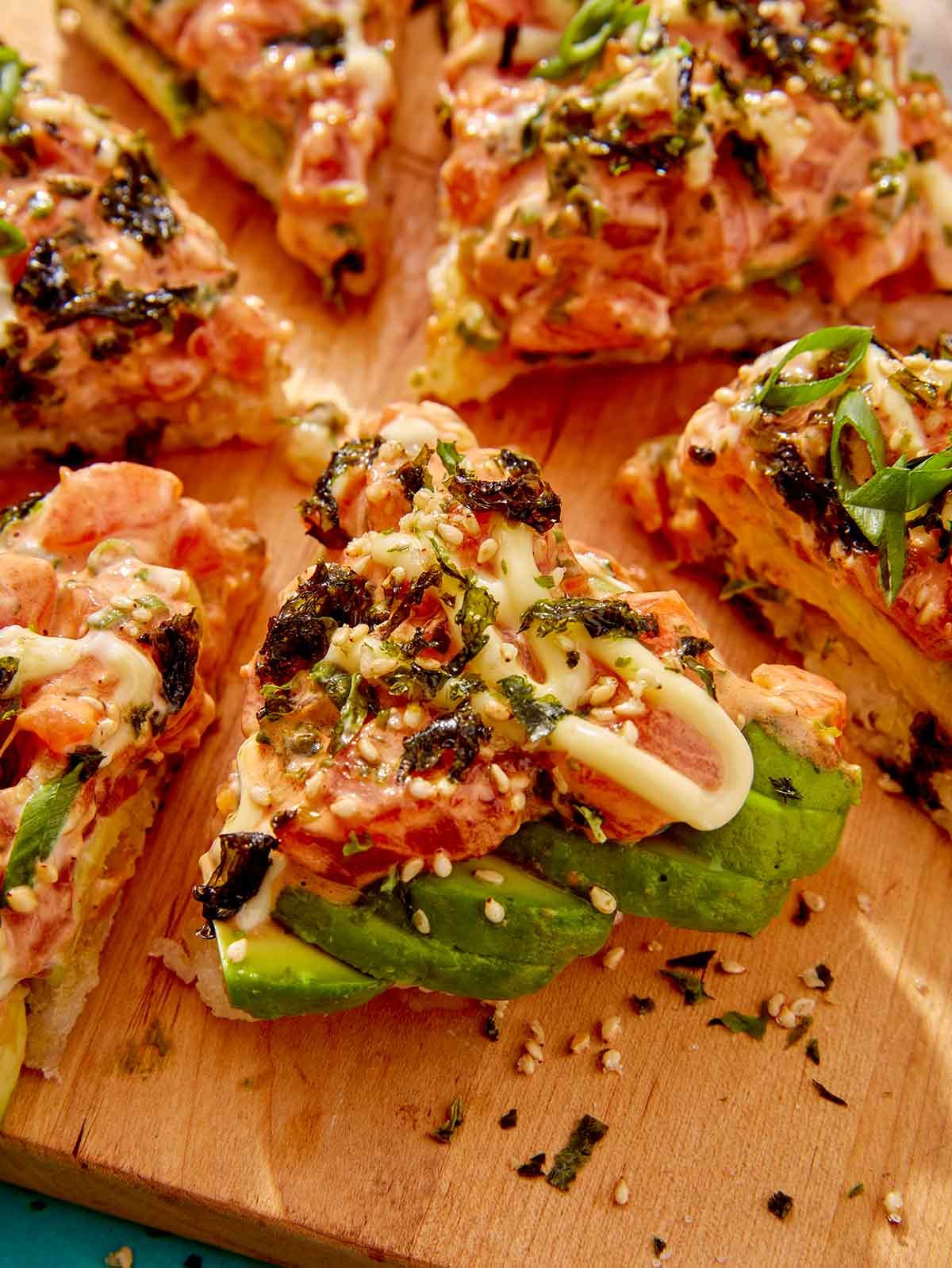Close up on a slice of sushi pizza. 