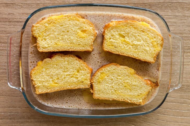 dipping bread into egg batter
