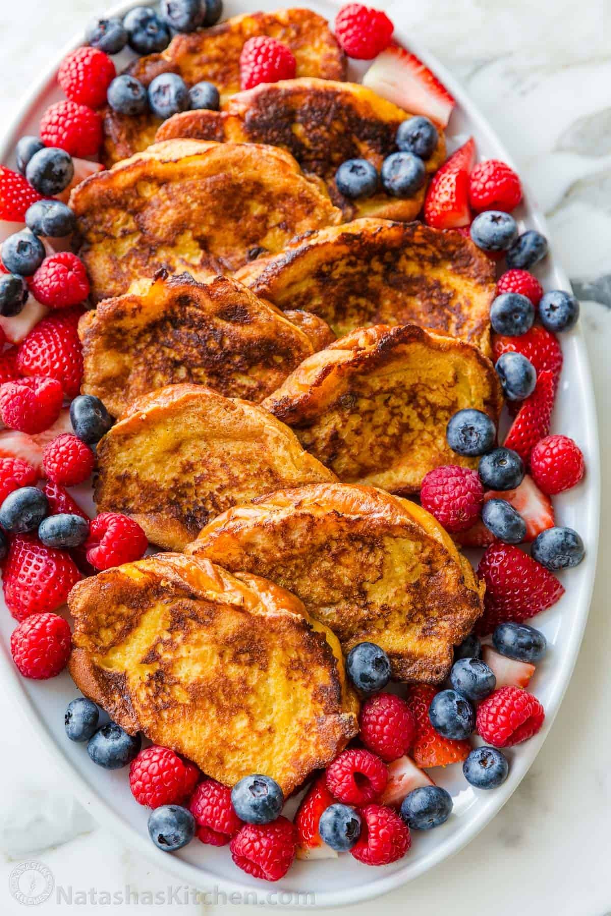 This will be your go-to French Toast Recipe. From the batter to the cooking method, it's easy, excellent, and works with a variety of bread. French toast arranged on a serving platter