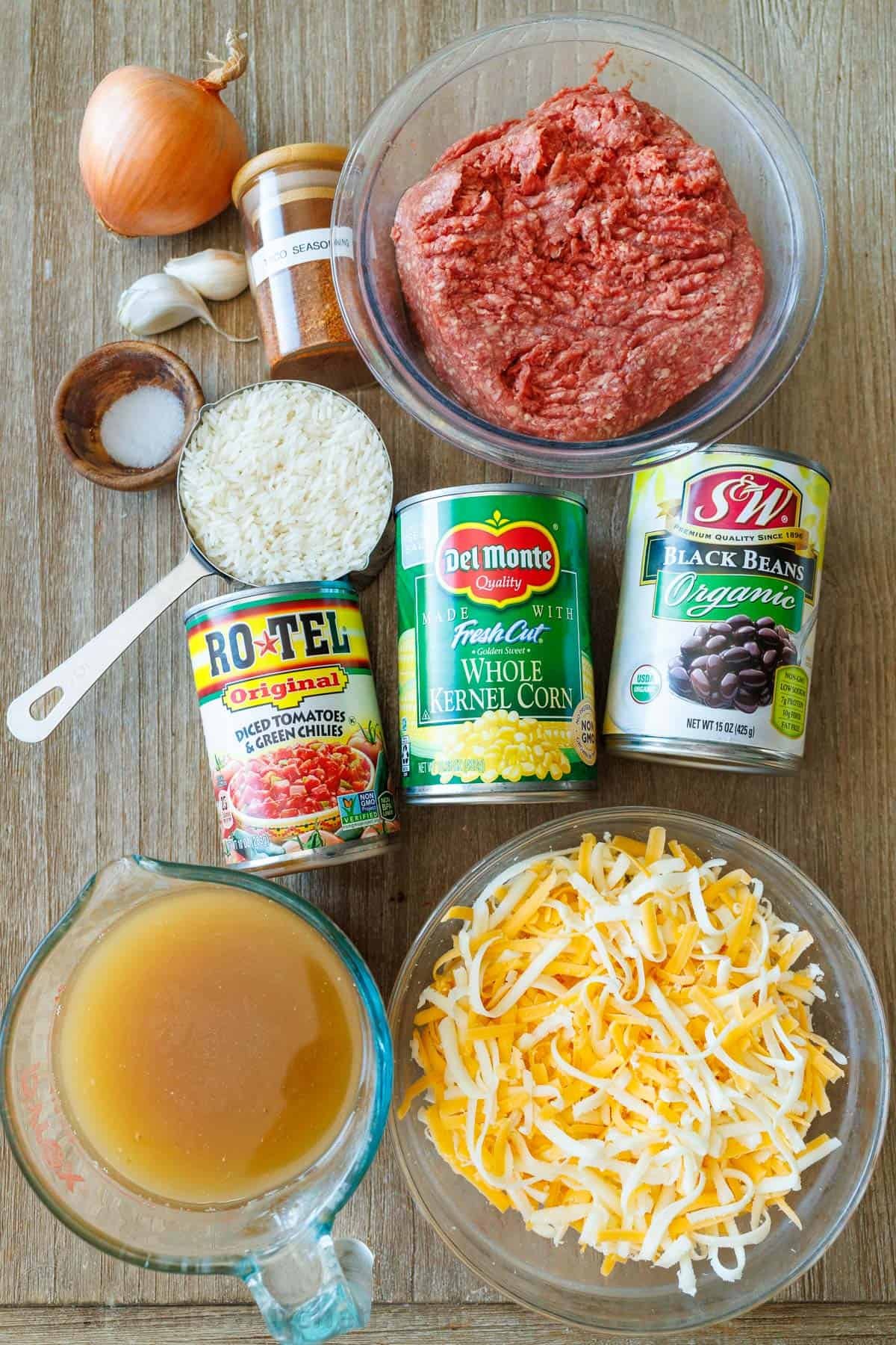 Ingredients for Mexican Beef and Rice Skillet: Ground beef, jasmin rice, chicken stock, garlic, salt, shredded cheese, black beans, onion, corn, Rotel tomatoes, taco seasoning Ingredients for Mexican Beef and Rice Skillet: Ground beef, jasmin rice, chicken stock, garlic, salt, shredded cheese, black beans, onion, corn, Rotel tomatoes, taco seasoning