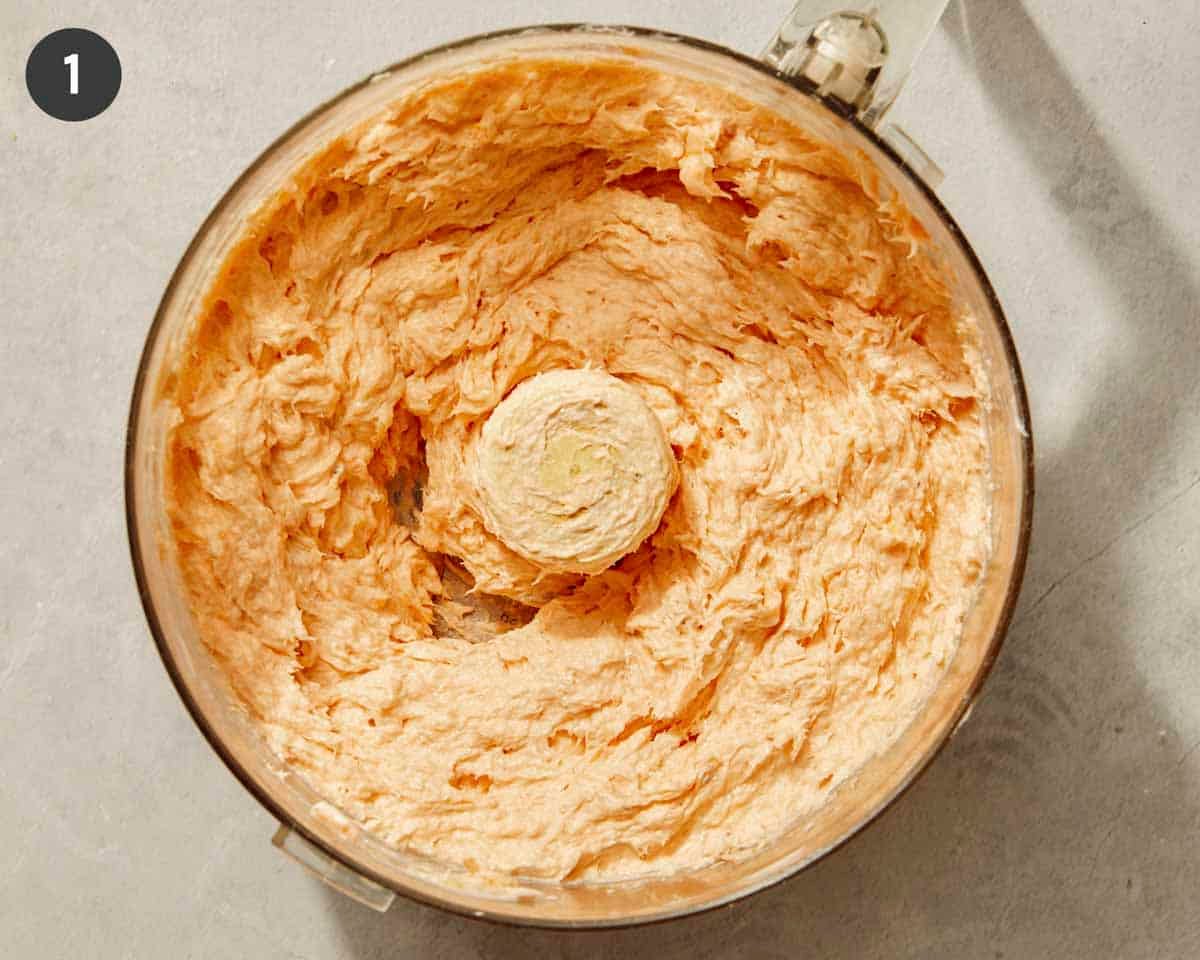 Smoked salmon dip ingredients in a food processor all blended up.