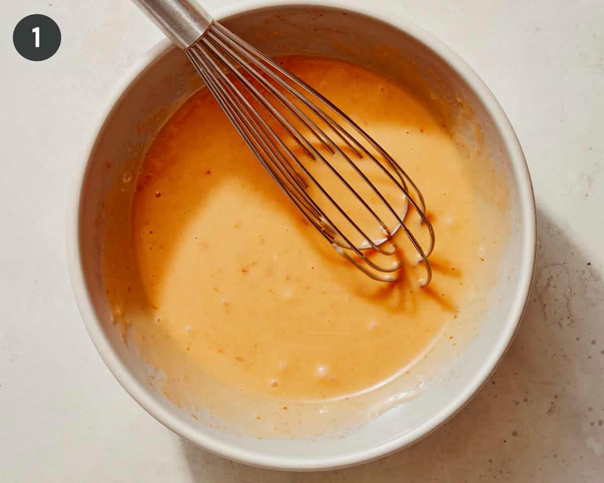 Bang bang sauce whisked together in a bowl.