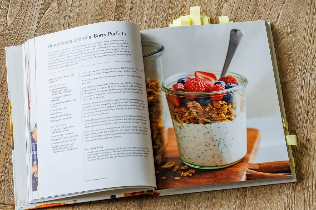 This Homemade Granola Recipe is one of my family's go-to healthy breakfast recipes because it's quick to make and ready to eat all week long. Natasha's Kitchen cookbook open on the counter showing Homemade Berry Parfaits
