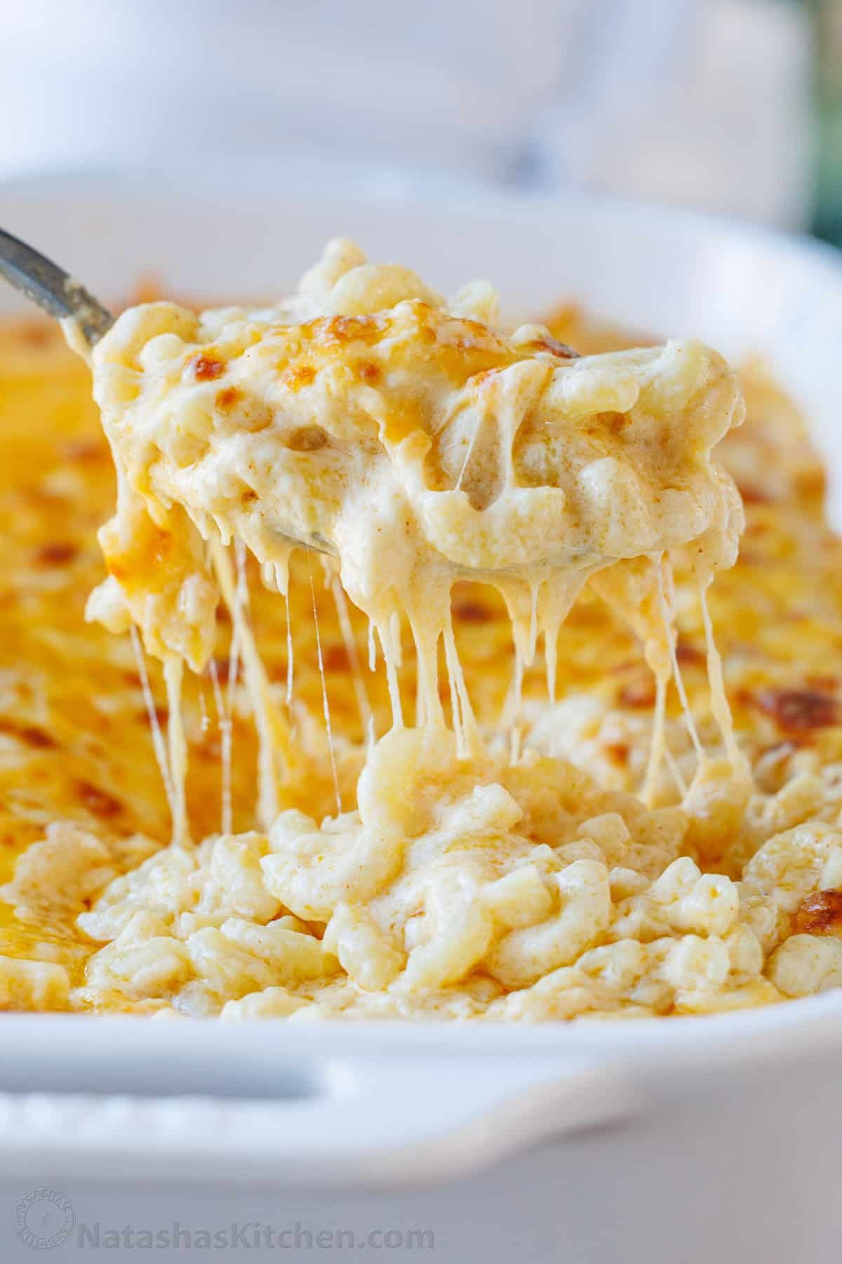 My Easy homemade Baked Mac and Cheese swaps the breadcrumbs for a crowd-pleasing cheese topping. It's perfectly gooey and easy to make. Baked Mac and Cheese scooped from a baking dish
