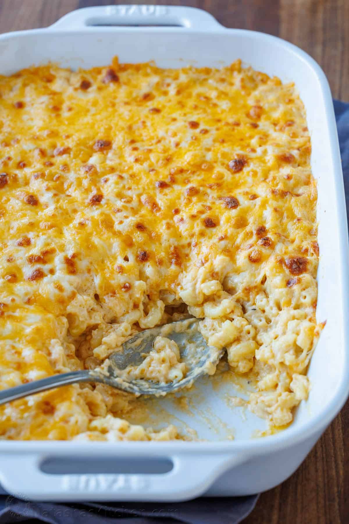 My Easy homemade Baked Mac and Cheese swaps the breadcrumbs for a crowd-pleasing cheese topping. It's perfectly gooey and easy to make. Baked Mac and Cheese with cheesy topping and serving removed