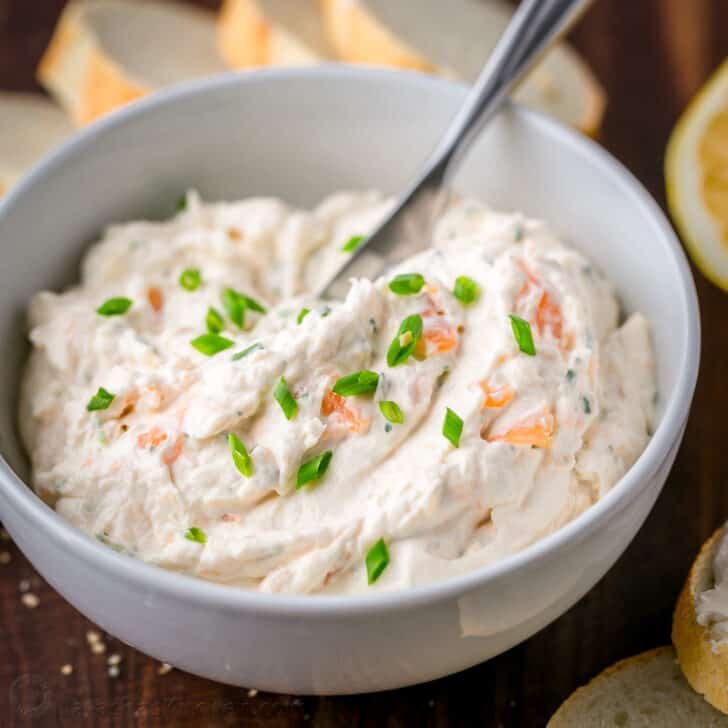 Smoked Salmon Dip Recipe served in a white bowl with chives and salmon