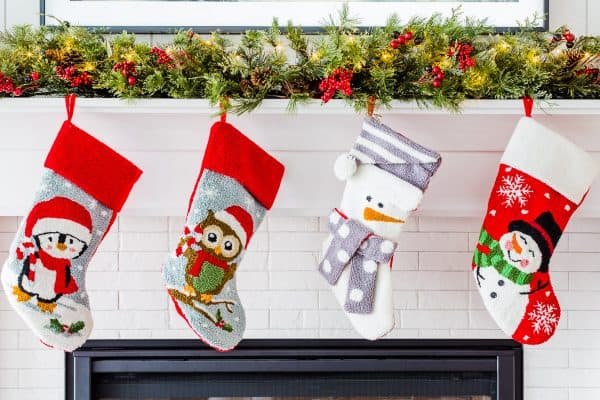A close up of four Christmas stockings