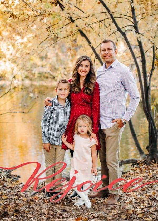 A Christmas card of a family that says Rejoice