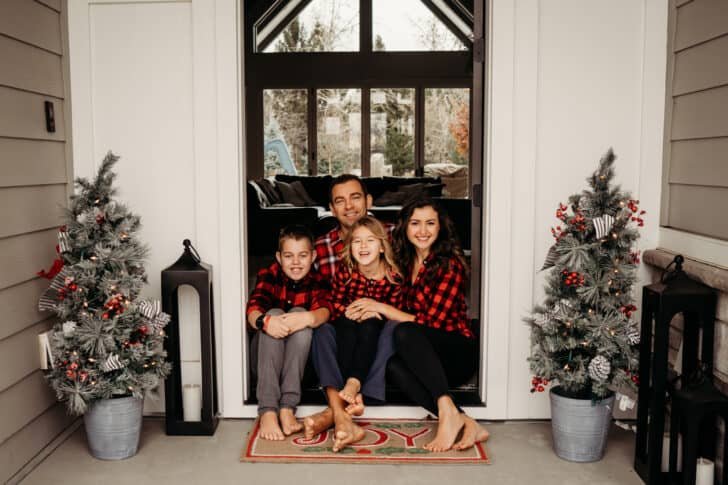 Family smiling at front porch sitting Family smiling at front porch sitting