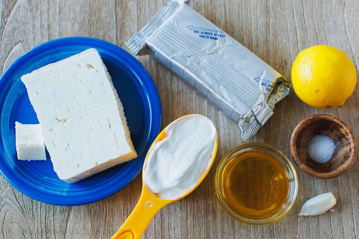 Ingredients for whipped feta dip with feta cheese, cream cheese and sour cream