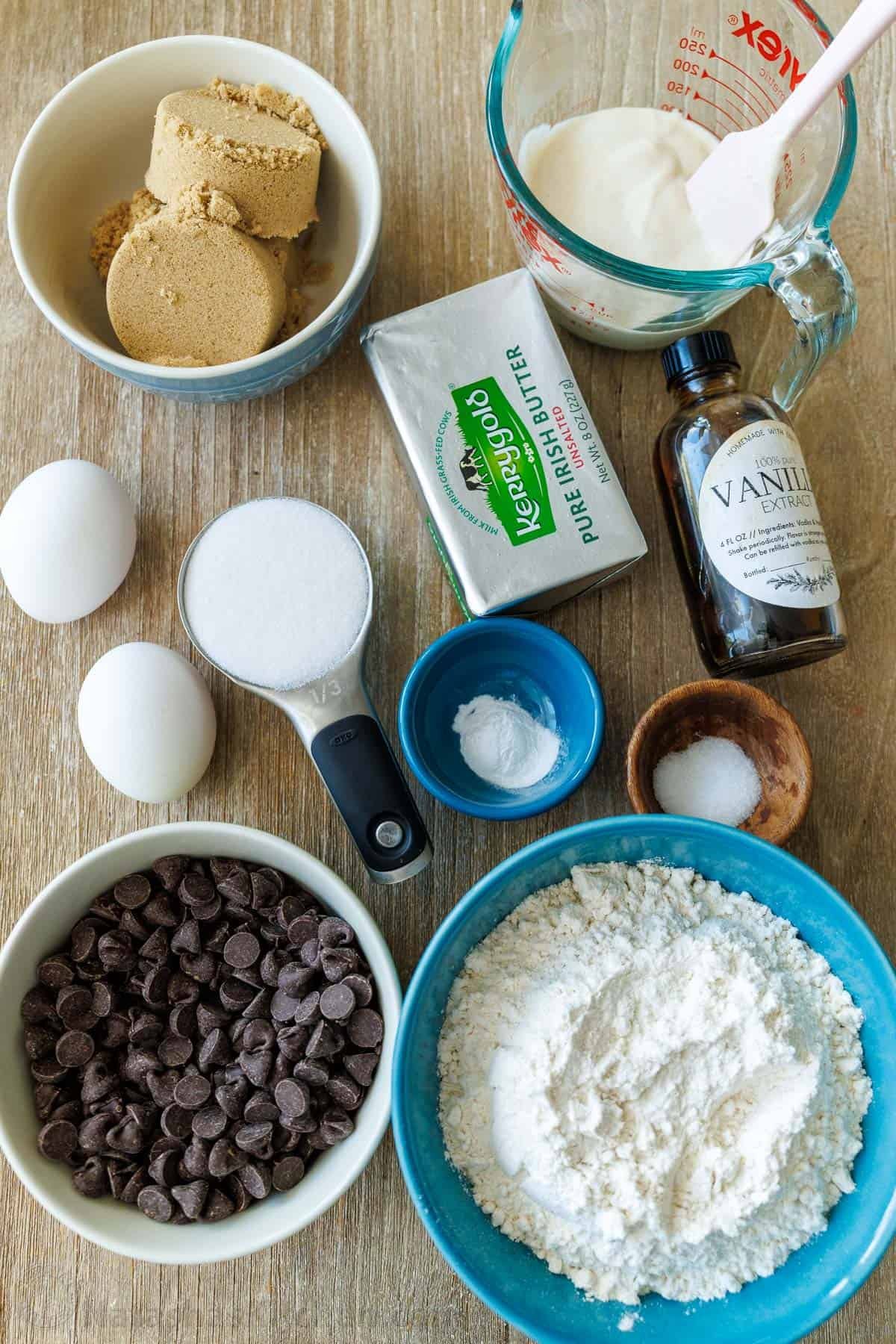 Soft-chewy sourdough chocolate chip cookies made with discard and loaded with chocolate chips. Step-by-step photos and easy video tutorial. Ingredients for the best discard recipes including brown sugar, discard, butter, vanilla extract, eggs, sugar, salt, baking soda, baking powder, flour and candy