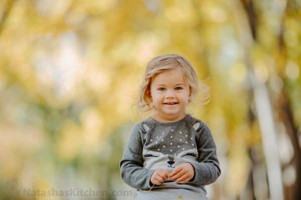 A little girl smiling at the camera