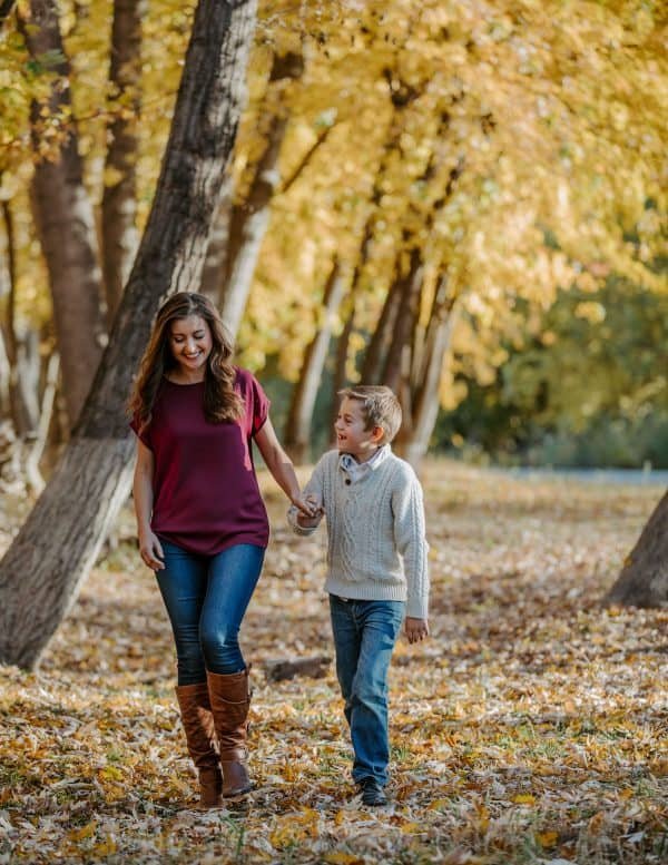 A mother and son walking at the park
