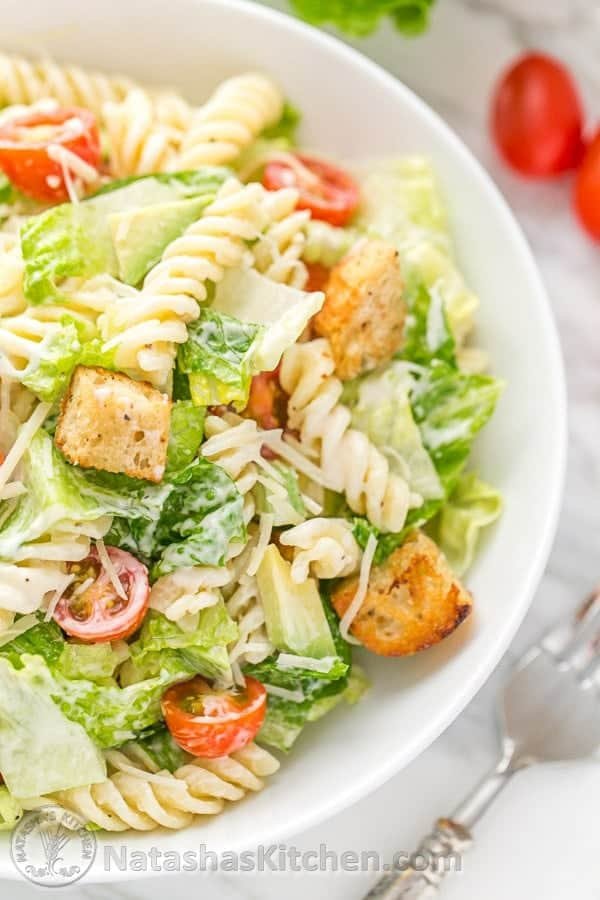 You have to try this Pasta Avocado Caesar Salad. Pasta Caesar Salad is an easy and family friendly weeknight meal! | natashaskitchen.com