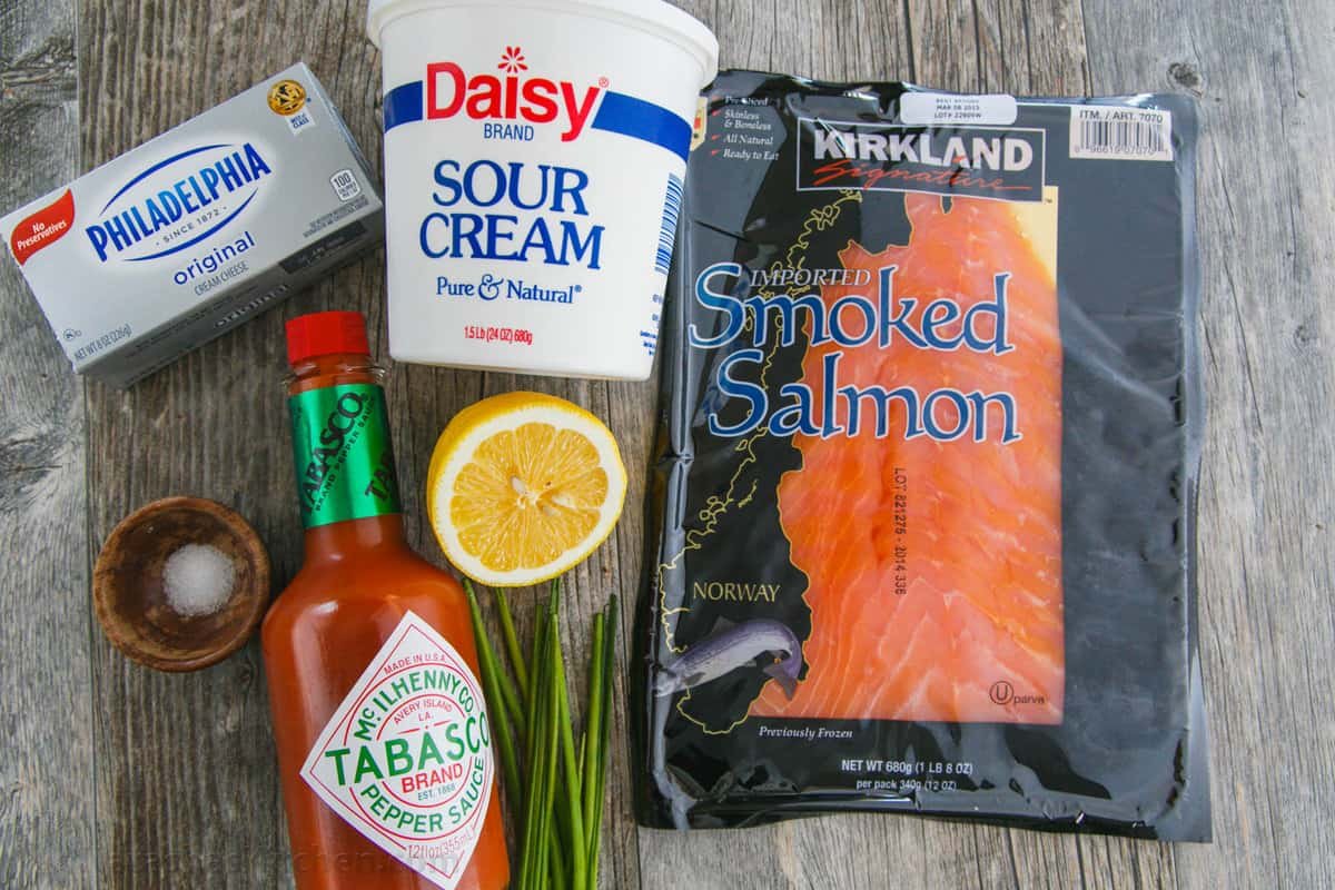 Ingredients for fish spread using cream cheese, salt, Tabasco, sour cream, lemon juice, chives and smoked fish