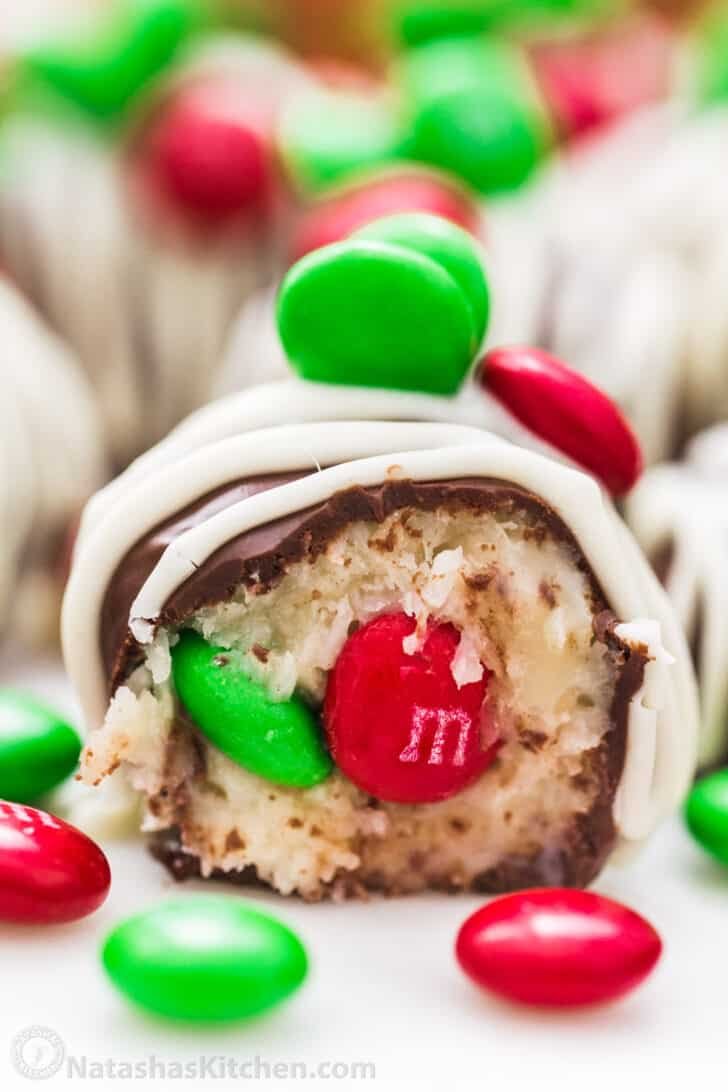 Chocolate Coconut Balls are an easy, no-bake treat. These M&M Christmas coconut candies are perfect for your holiday cookie platter. Center of a chocolate coconut ball