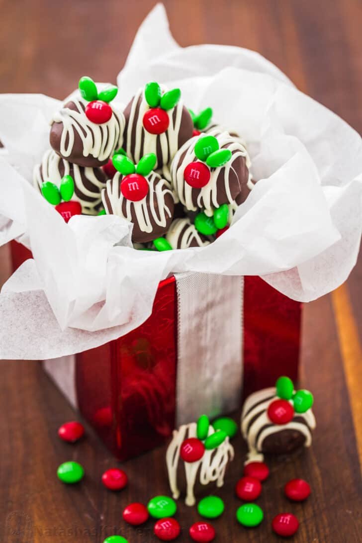 Chocolate Coconut Balls are an easy, no-bake treat. These M&M Christmas coconut candies are perfect for your holiday cookie platter. Decorated Christmas coconut bites in gift box