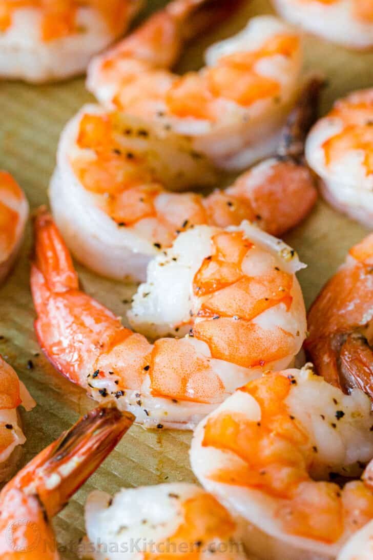 Baked Shrimp for Shrimp cocktail Close up of peeled and deveined baked shrimp with tail on
