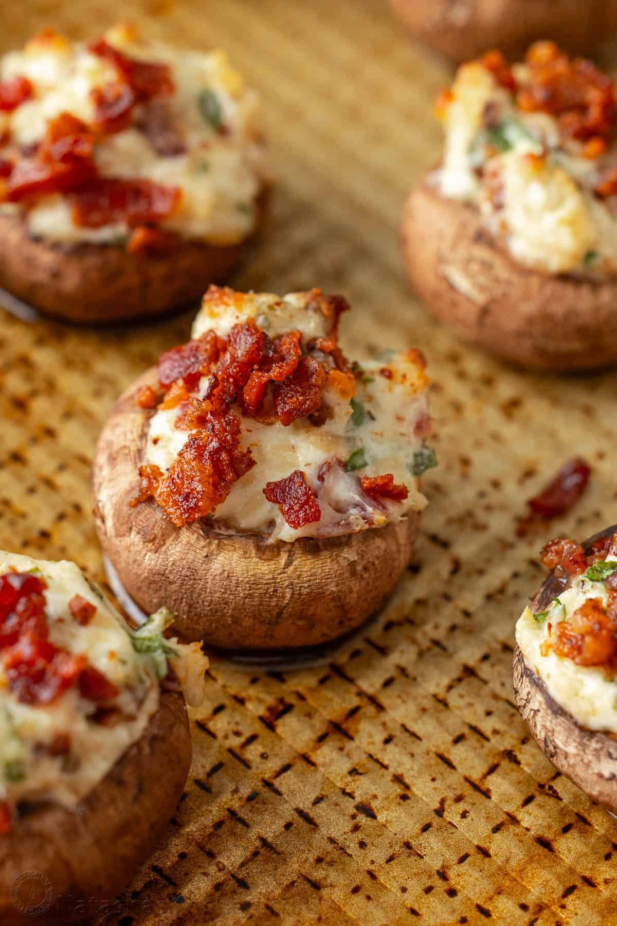 This is the best stuffed mushrooms recipe for your next party. The bite-sized appetizer is stuffed with cream cheese, bacon bites and garlic. Baked Stuffed Mushroom recipe with cream cheese and bacon