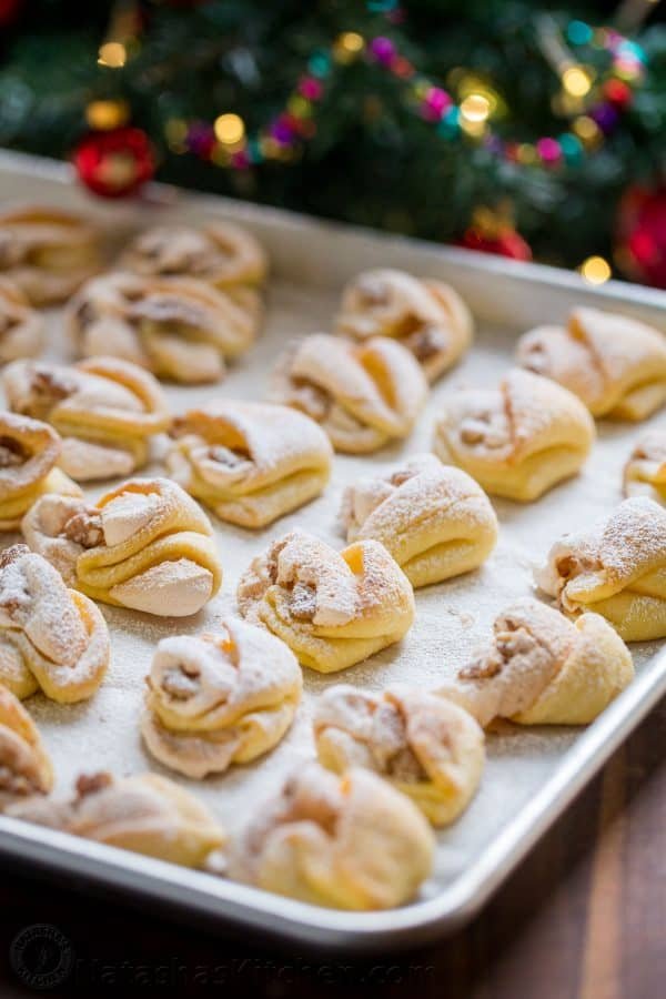 Meringue Shell Cookies have a crisp ribbon of meringue and soft crumbly center. These walnut meringue cookies are completely irresistible Christmas cookies! | natashaskitchen.com